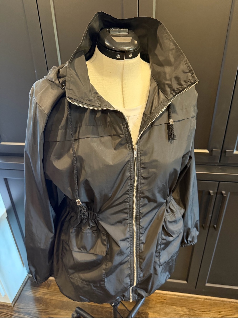 Women’s lightweight black drawstring rain or wind jacket w/ hood